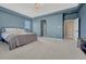 Spacious main bedroom with tray ceiling, large windows, and plush carpeting at 14667 Crouch Pl, Parker, CO 80134