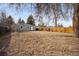 Spacious backyard with wooden fence, providing ample space for outdoor enjoyment and entertaining at 1734 Kingston St, Aurora, CO 80010