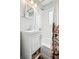 Clean bathroom featuring a classic vanity, tub with subway tile surround, and bright lighting at 1734 Kingston St, Aurora, CO 80010