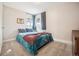 This bedroom has neutral walls and carpeting, complemented by two windows and curtains at 1734 Kingston St, Aurora, CO 80010