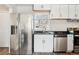 Clean kitchen with stainless steel appliances and white cabinetry at 1734 Kingston St, Aurora, CO 80010