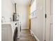 Convenient laundry room with modern appliances, offering functionality and efficiency at 1734 Kingston St, Aurora, CO 80010