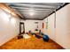 Basement with exposed ceiling, carpeted floor, and plenty of space for activities at 530 Windmill Rd, Castle Rock, CO 80108