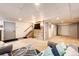 Finished basement featuring a tv and staircase to main floor at 530 Windmill Rd, Castle Rock, CO 80108