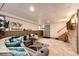 Finished basement features a tv and staircase to main floor at 530 Windmill Rd, Castle Rock, CO 80108