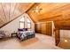 Upstairs bedroom features vaulted ceilings, dormer windows, and closet space at 530 Windmill Rd, Castle Rock, CO 80108