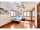 Bright bedroom with hardwood floors, natural light, and double mirrored closet at 530 Windmill Rd, Castle Rock, CO 80108