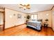 Main bedroom with hardwood floors, a window, and neutral wall paint at 530 Windmill Rd, Castle Rock, CO 80108