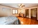 Main bedroom featuring hardwood floors, a large window, and a vanity at 530 Windmill Rd, Castle Rock, CO 80108