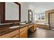 Bathroom features double sinks, granite counters, and a tiled tub and shower at 7430 E Bayaud Ave, Denver, CO 80230