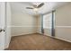 Bedroom with neutral tones, window with blinds, and ceiling fan at 7430 E Bayaud Ave, Denver, CO 80230