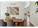 Dining room with hardwood floors, decorative molding, and a view of kitchen at 7430 E Bayaud Ave, Denver, CO 80230