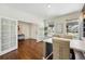 Bright dining room featuring hardwood floors, white walls, view to front yard, and elegant furniture at 7430 E Bayaud Ave, Denver, CO 80230