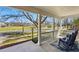 Inviting front porch with rocking chairs and view of the surrounding neighborhood at 7430 E Bayaud Ave, Denver, CO 80230