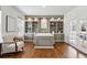 Elegant office with custom built-in shelving, hardwood floors, and ample natural light at 7430 E Bayaud Ave, Denver, CO 80230