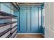 Walk-in closet with wire shelves and drawers for efficient storage at 7430 E Bayaud Ave, Denver, CO 80230