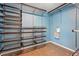 Walk-in closet with metal shelves and baskets for storage at 7430 E Bayaud Ave, Denver, CO 80230