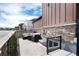 Outdoor patio with cozy seating area, stylish stone accents, and basement access at 9804 Rosalee Peak St, Littleton, CO 80125