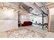Unfinished basement with exposed beams and potential for a home gym and Gathering area at 9804 Rosalee Peak St, Littleton, CO 80125
