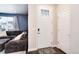 Inviting entryway with a stylish front door, modern finishes, and seamless access to the living area at 9804 Rosalee Peak St, Littleton, CO 80125