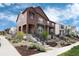 Charming townhome featuring professionally landscaped front yard and inviting entrance in a modern neighborhood at 9804 Rosalee Peak St, Littleton, CO 80125