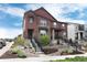 Charming home showcasing detailed stonework, meticulous landscaping, and an inviting entrance at 9804 Rosalee Peak St, Littleton, CO 80125