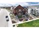 Inviting two-story home featuring a beautifully landscaped front yard and a charming facade at 9804 Rosalee Peak St, Littleton, CO 80125
