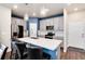 Modern kitchen with stainless steel appliances, white cabinets, and a bright, airy feel at 9804 Rosalee Peak St, Littleton, CO 80125