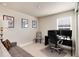 Office space features multiple monitors and a neutral color palette with decor for inspiration and focus at 9804 Rosalee Peak St, Littleton, CO 80125
