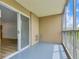 Enclosed balcony featuring neutral paint and a sliding glass door entrance at 13606 E Bates Ave # 304, Aurora, CO 80014