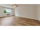 Bright bedroom with wood floors, a ceiling fan, and ample natural light at 13606 E Bates Ave # 304, Aurora, CO 80014