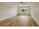 Bedroom featuring wood floors, a ceiling fan, and natural light from the window at 13606 E Bates Ave # 304, Aurora, CO 80014