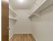 Walk-in closet with built-in shelving for efficient storage at 13606 E Bates Ave # 304, Aurora, CO 80014