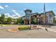 Inviting Henderson community building, landscaped for curb appeal and a decorative entry tower of natural stone at 13606 E Bates Ave # 304, Aurora, CO 80014