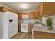 Cozy kitchen showcasing wooden cabinets, modern appliances, and stylish countertops for cooking at 13606 E Bates Ave # 304, Aurora, CO 80014