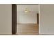 Large living room with wood floors, ceiling fan, and a neutral color palette at 13606 E Bates Ave # 304, Aurora, CO 80014