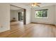 Spacious living room featuring hardwood flooring and a sliding glass door to a balcony at 13606 E Bates Ave # 304, Aurora, CO 80014