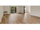 Bright living room with wood floors and sliding glass doors leading to a balcony at 13606 E Bates Ave # 304, Aurora, CO 80014
