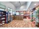 Well-stocked pro shop featuring a point-of-sale station and multiple displays of golf merchandise and refreshments at 13606 E Bates Ave # 304, Aurora, CO 80014