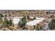 Aerial view shows well-maintained community buildings with landscaping and parking areas at 2281 Vaughn # 104A, Aurora, CO 80014