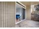 Outdoor patio with sliding glass door opening into the living room, offering seamless indoor-outdoor living at 2281 Vaughn # 104A, Aurora, CO 80014