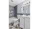Updated bathroom features a tile shower, modern vanity, and stylish flooring at 2281 Vaughn # 104A, Aurora, CO 80014