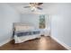 Cozy bedroom with a comfortable bed, soft lighting, and bright natural light at 2281 Vaughn # 104A, Aurora, CO 80014