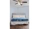 Comfortable bedroom featuring a ceiling fan, stylish headboard, and natural light at 2281 Vaughn # 104A, Aurora, CO 80014