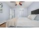 Serene bedroom with soft bedding and a ceiling fan at 2281 Vaughn # 104A, Aurora, CO 80014
