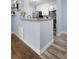 Charming kitchen features white cabinets, stainless steel appliances, and stylish countertops at 2281 Vaughn # 104A, Aurora, CO 80014