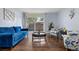 Bright and airy living room with comfortable seating and sliding glass doors to outdoor space at 2281 Vaughn # 104A, Aurora, CO 80014