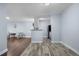 Inviting living room flowing into an updated kitchen with modern appliances and stylish flooring at 2281 Vaughn # 104A, Aurora, CO 80014