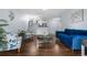 Charming living room featuring hardwood floors, stylish furniture, and a bright, airy atmosphere at 2281 Vaughn # 104A, Aurora, CO 80014