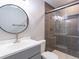 Modern bathroom featuring a glass-enclosed shower with tiled walls and contemporary fixtures at 421 E Highline Cir, Centennial, CO 80122